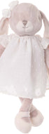 Peluche lapin rose Léna de Bukowski Design, jambes croisées, portant une robe blanche et un nœud sur l’oreille.